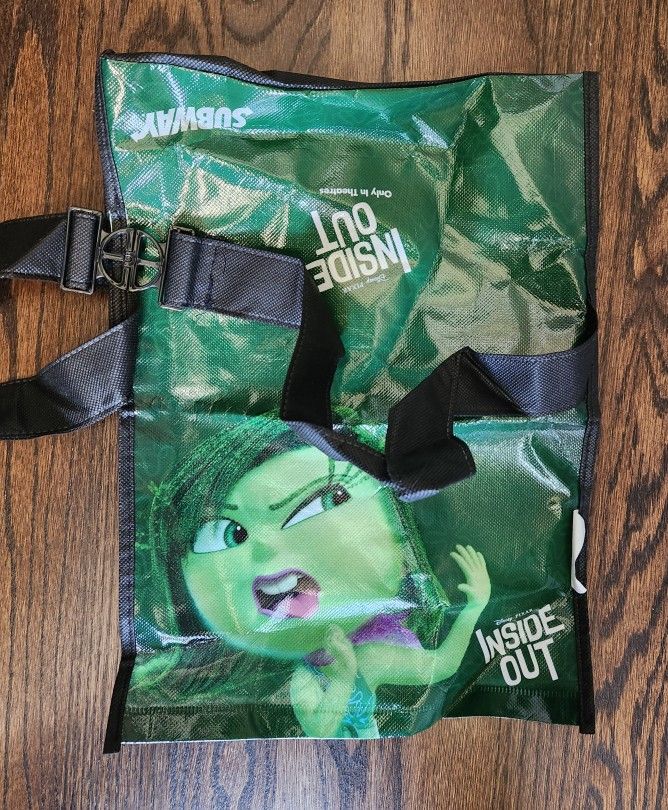 Subway Disney/Pixar Inside Out Canvas Lunch Bag with single character "Disgust" in all Green, White lettering. 
Black Adjustable strap handle. NEW