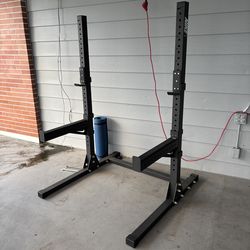 Squat rack and safety spotters