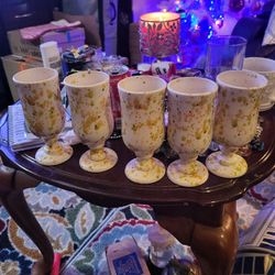 vintage ceramic studio pottery pedestal mugs with an orange and green speckled patter