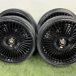 New 26 inch gloss black wheels with cadillac floating caps and Lexani  305/30r26 tires