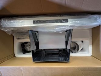 Divan range hood with 10 year warranty card, oven glove, and kitchen towels included