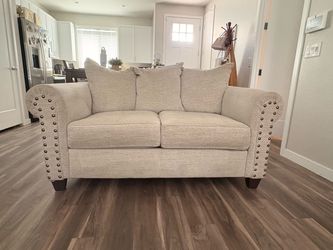 Beige Fabric Loveseat with Nailhead Trim