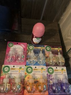 Air wick oil refills and a air wick automatic sprayer