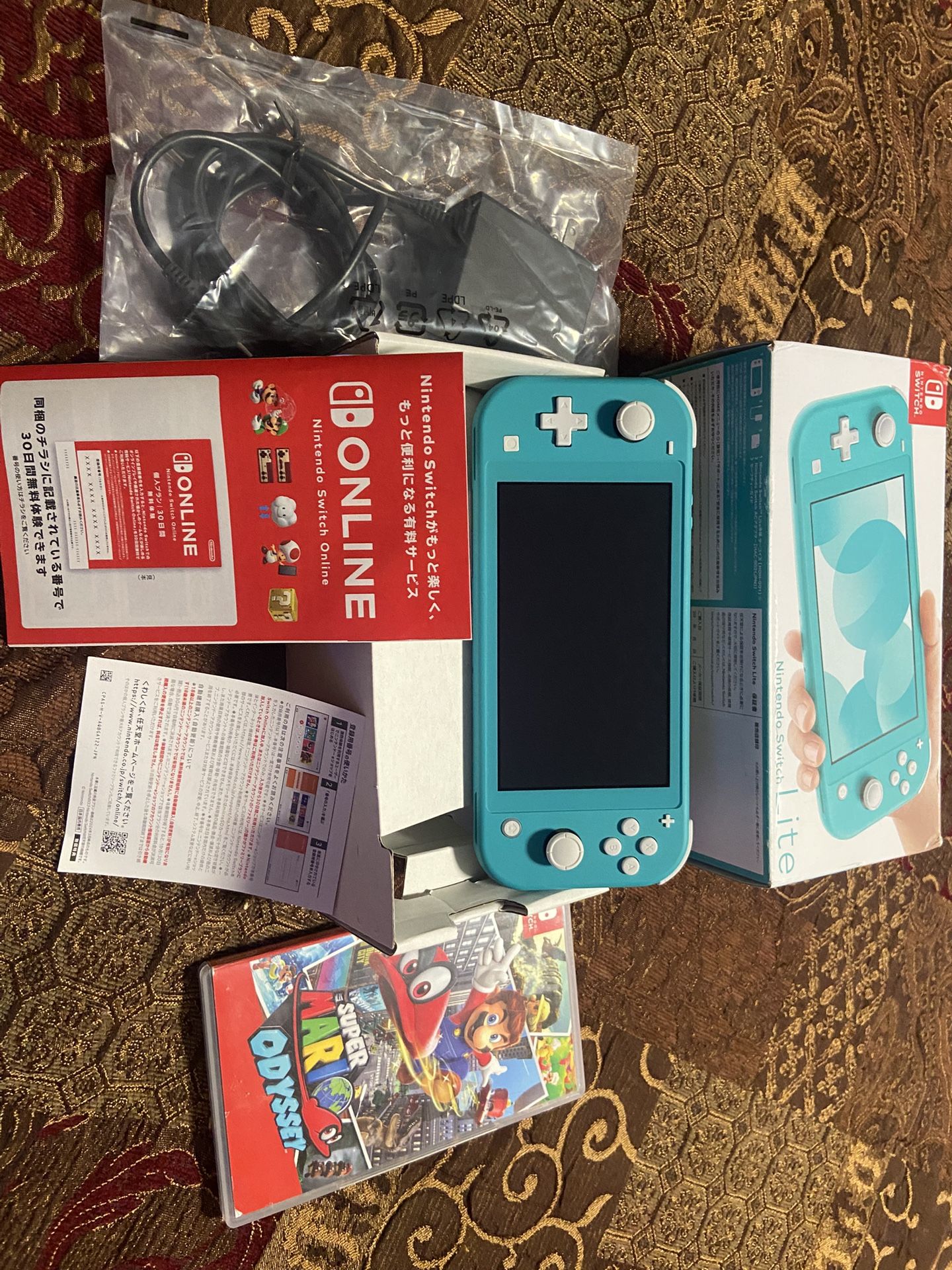Nintendo Switch Lite (Turquoise) + Super Mario Odyssey