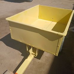 Tractor dumping wagon cleanup