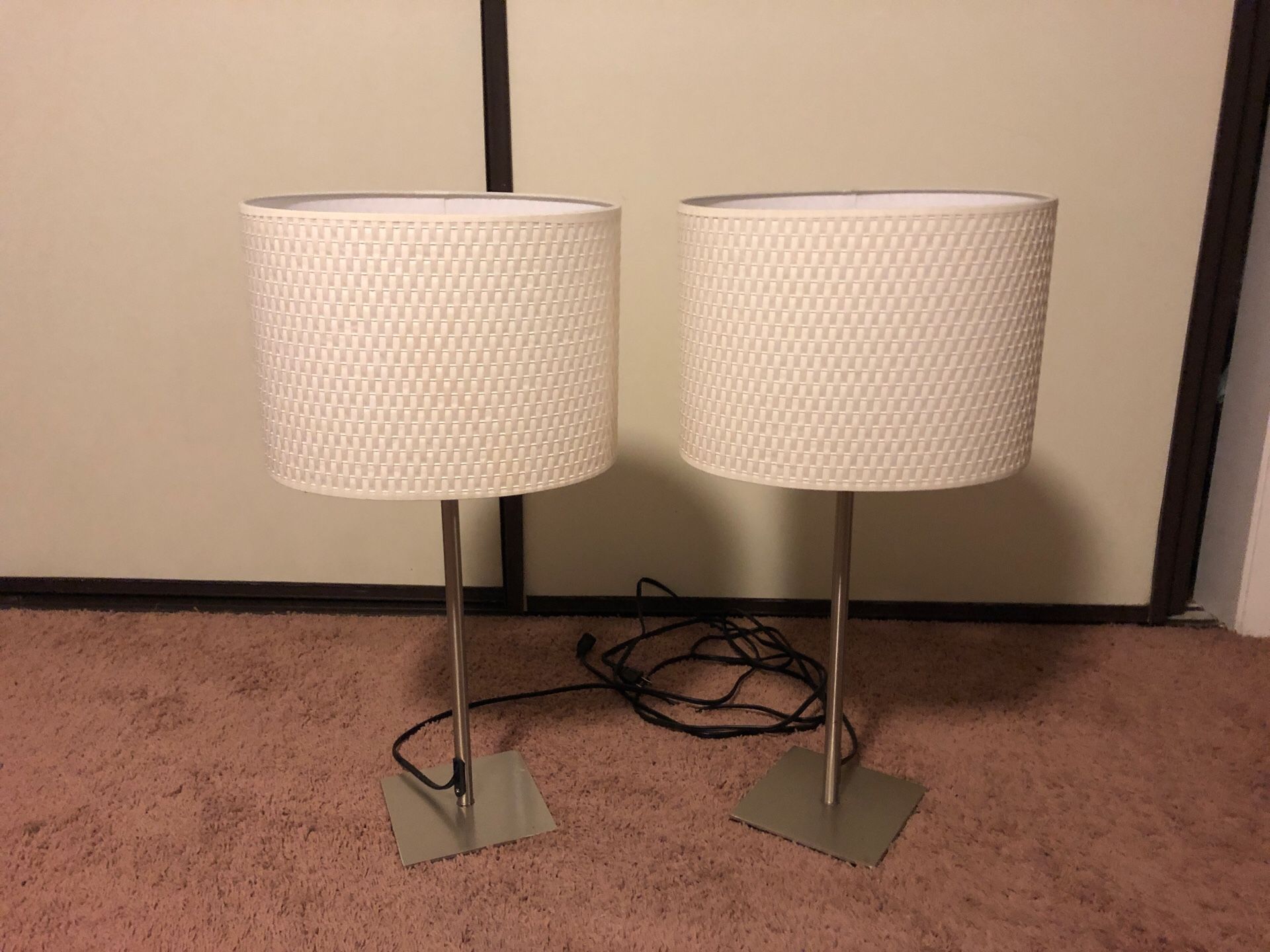 Two matching white lamps