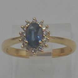 14kt yellow gold ring 2.8 grams ; 14 diamonds 0.14 total ;oval sapphire size 6.5. 889792-4. 