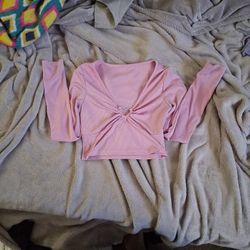 pink crop top with a silver gem heart and long sleeves 