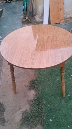 Round Wood Dining Table with Turned Legs