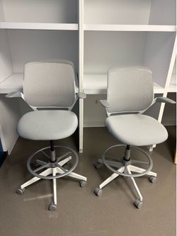 6 white Steelcase chairs
