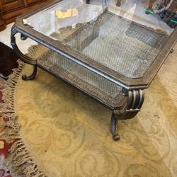 Metal and glass coffee table… with beveled glass… 47” wide , 34” depth , 20” high . $175 