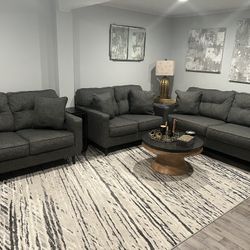 moving out sale. like new condition. Ashley furniture 4 pieces Charcoal living room sets.