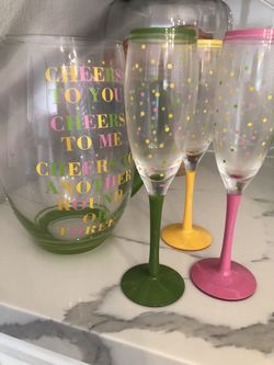 Pitcher with 3 champagne glasses.