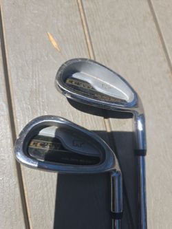 Two golden bear irons 8 and 9 golf club irons.