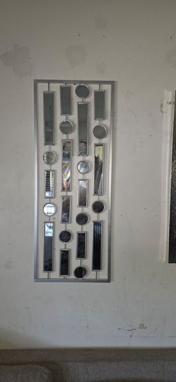 Wall decor mirror silver color needs cleaning