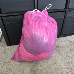 Mediums Sized Trash Bag Stuffed With 4t Girls Clothes