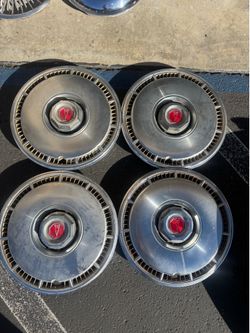 1980s factory original Pontiac hubcaps