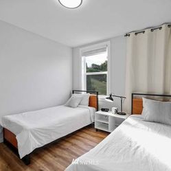 2 wood/metal twin beds