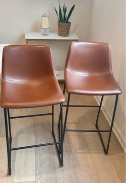 2 Caramel Faux Leather Bar Stools $150