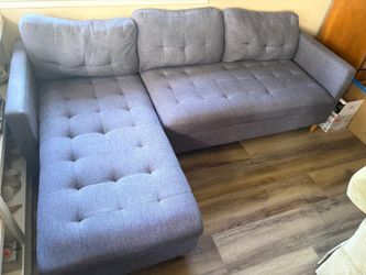 A mid-century modern style L-shaped sectional with a three-seat sofa