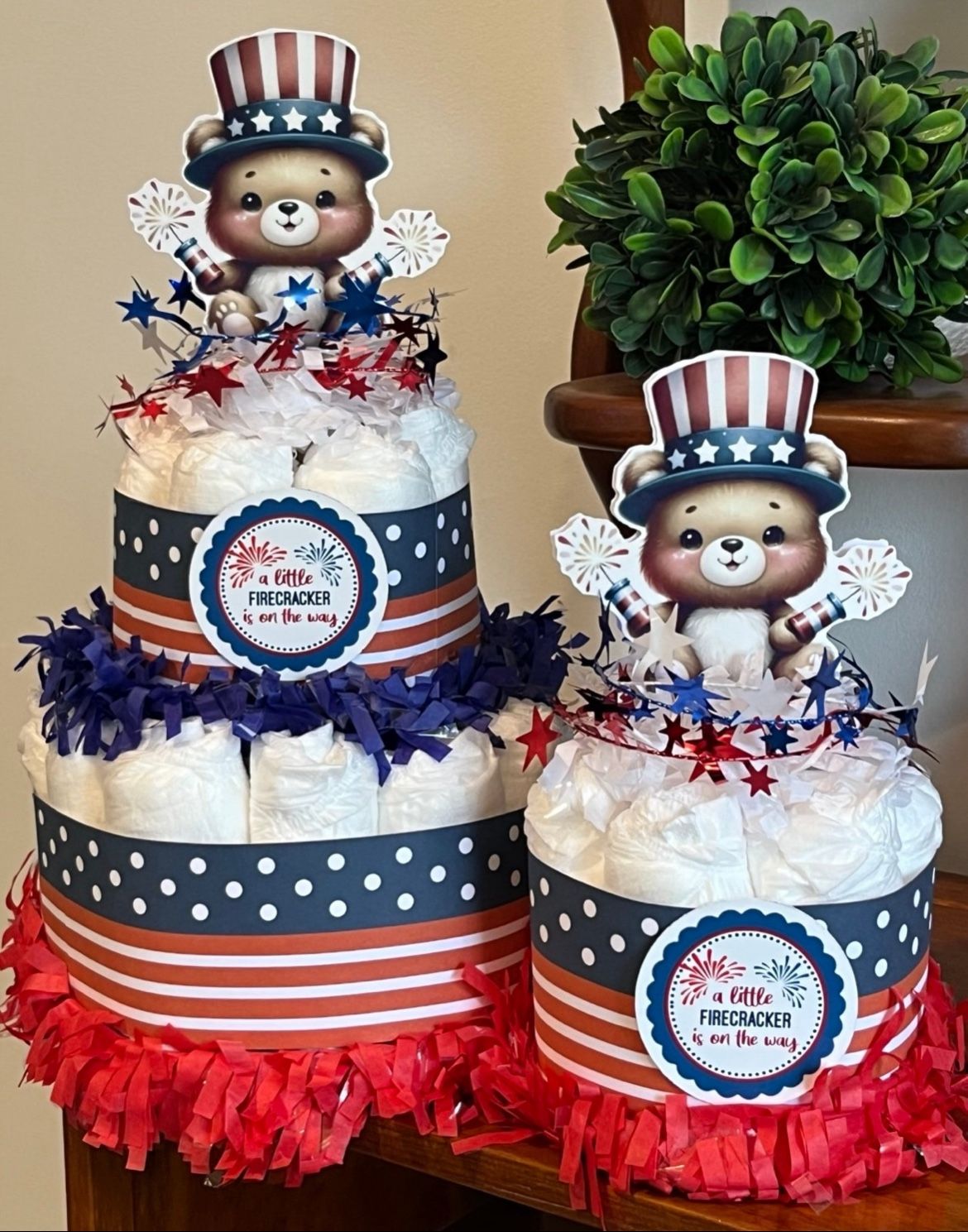 A LITTLE FIRECRACKER is on its way red white blue diaper cakes