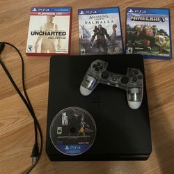 Sony PlayStation 4 Black With 4 Games, Remote, And Cord 
