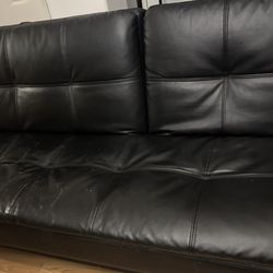 Black couch turns into a bed