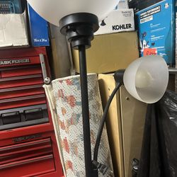 Floor lamp black  use good working conditions come wt two lights section take look the picture   Only $40