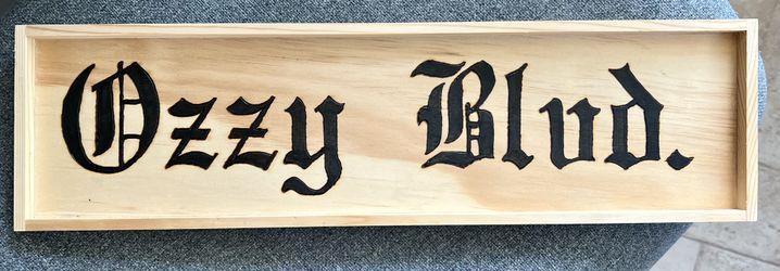 Woodburned Ozzy Blvd. Sign
