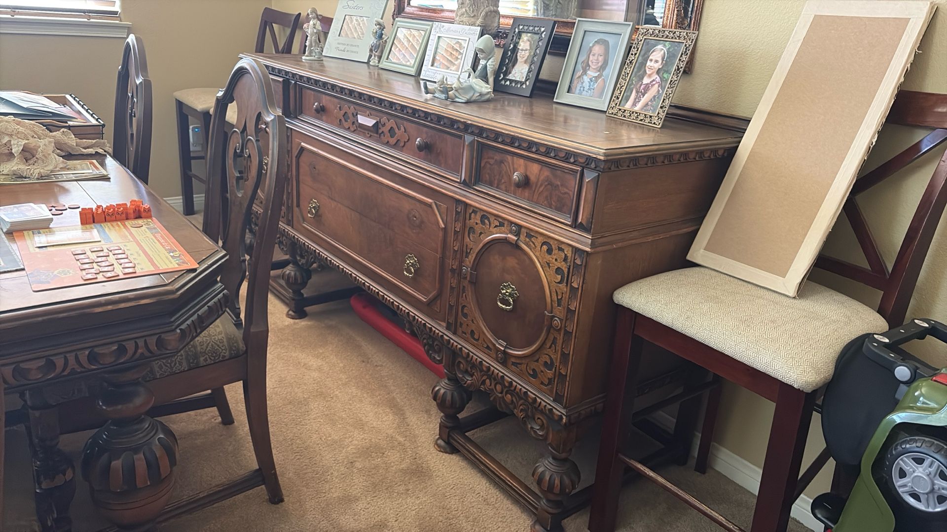 Antique buffet table with six chairs in China cabinet over 120 years old