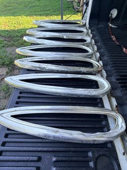 Tail light bezels for a 1959 Chevrolet Impala.