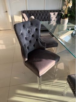 Gray velvet tufted wingback dining chair and table