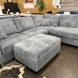 Gray Corduroy Sectional with storage ottoman