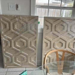 West Elm Graphic Wood Hexagon Dimensional Wall Art panels made of engineered whitewashed wood.