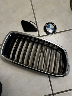 BMW 1 OEM Front Left Grilled, Badge, Bumper Tow Cover Piece.