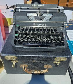 Vintage black Underwood Universal portable typewriter from the early 1940s with original carrying case.