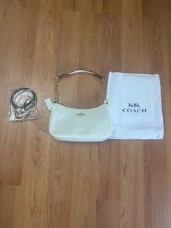 white and cream coach shoulder bag