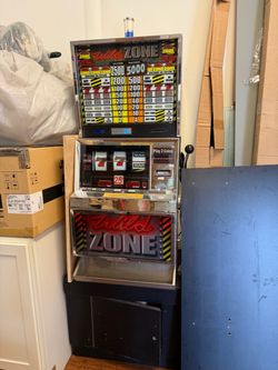 This is a 1996 WMS/Williams Wild Zone, Model 401, with a stand.