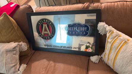 Vintage rare promotional promotional mirror features the Deep Eddy Vodka logo and the Atlanta United FC emblem, marking the brand as the official vodk