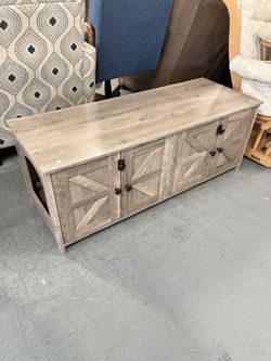 Low grey Tv stand with opening for cat (in store)