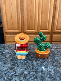 Vintage Ceramic Man In Poncho With a  Cactus Pair of Salt & Pepper Shakers.  Preowned never used.  Size tallest approximately 3 inches tall.  Has been