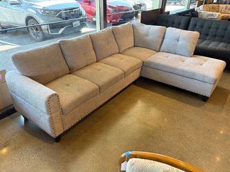 Light Grey L-Shaped Sectional with Nailhead Trim and Fold Down Tray