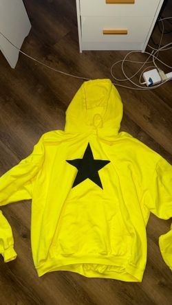 ye at SoFi concert yellow hoodie