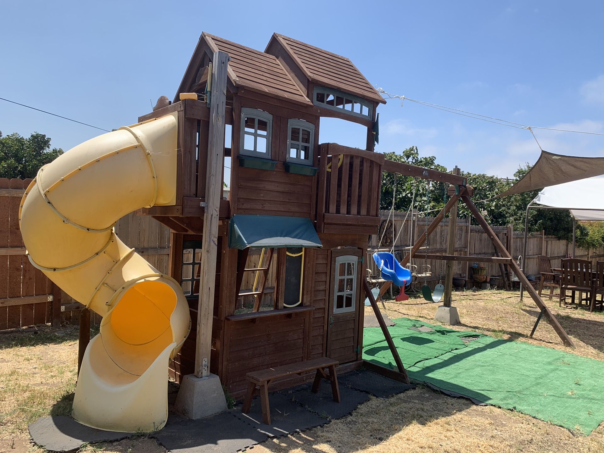 Backyard swing set with slide