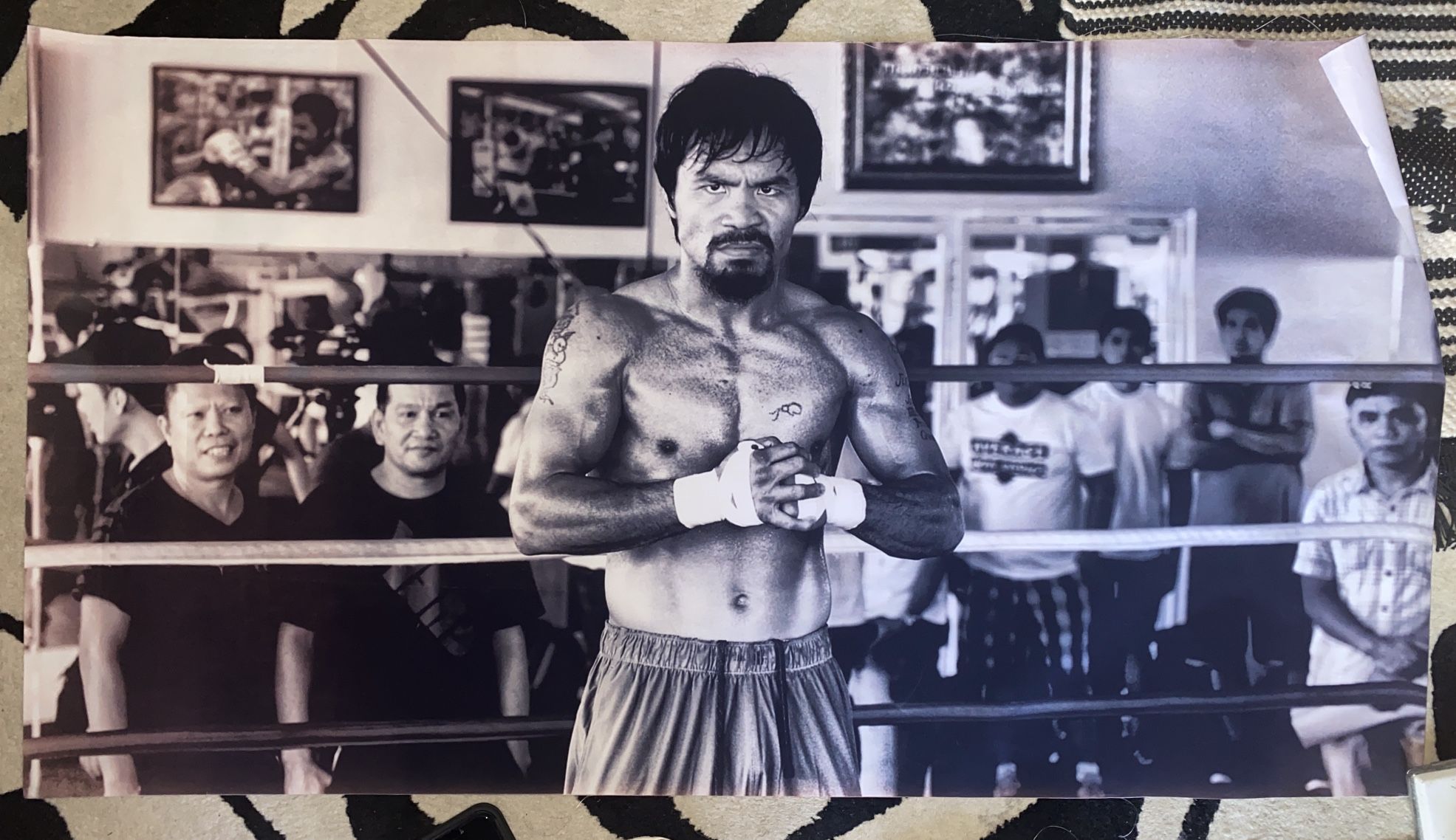 This manny pacquiao poster has been previously enjoyed and is ready for a new home. It features the iconic boxer in action and would be a great additi