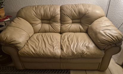 Beige Leather Sofa, loveseat and coffee table.