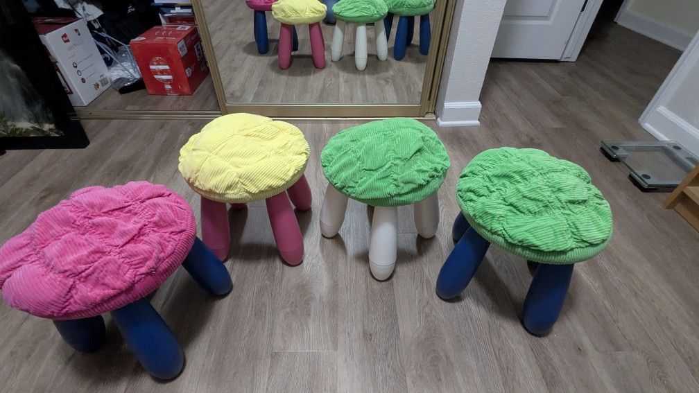 Set of 4 Ikea MAMMUT stools, blue, red, and white cushion covers