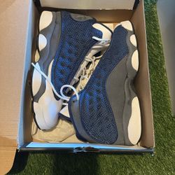 Nike Air Jordan 13 Retro "Flint" sneakers in the Navy/Carolina Blue/Flint Grey/White colorway. 