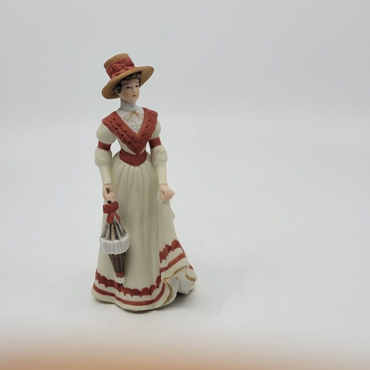 Vintage Lenox The Great Fashions of History Sarah Figurine Edwardian 
Period 1. Fine porcelain.  Pre-owned, very good shape, no chips 
or crac
