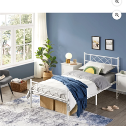 twin white metal bed frame with mattress